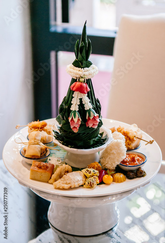 Thai assorted traditional dessert snack on ceramic pedestal tray photo