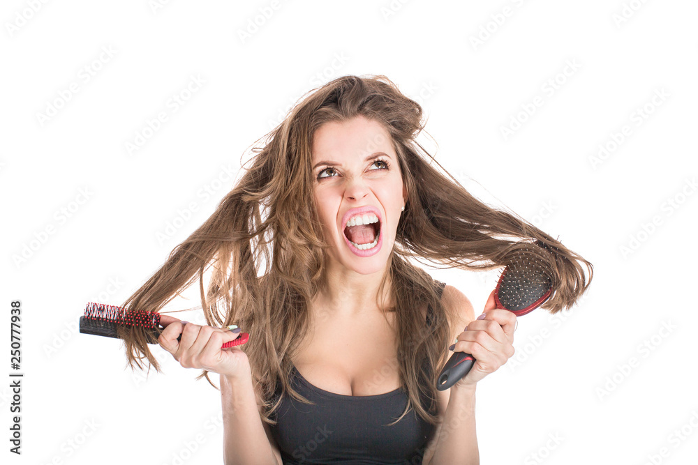 The girl who combing their hair. Hair care concept The girl who combing their hair. Hair care concept