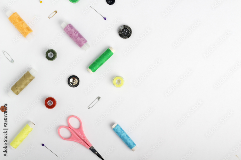 White background with different tools for sewing and tailoring White background with different tools for sewing and tailoring