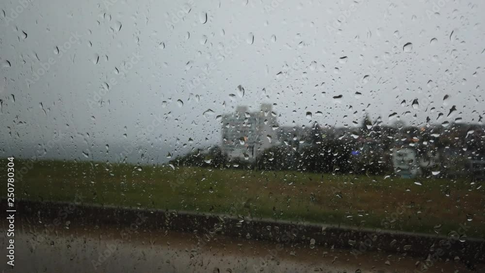 Raindrop on the glass with outdoor view. Raindrop on the glass with outdoor view.