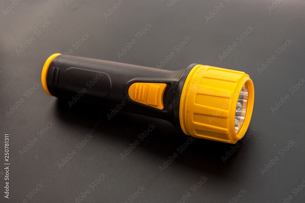 LED flashlight yellow color and black handle the tool in the emergency time LED flashlight yellow color and black handle the tool in the emergency time