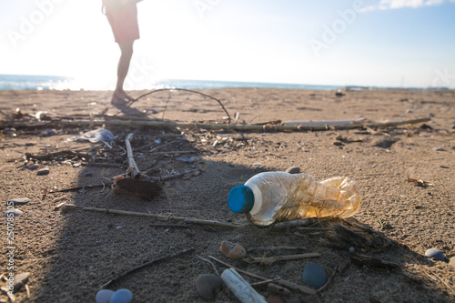 Pollution on the beach of tropical sea. Plastic garbage, foam, wood and dirty waste