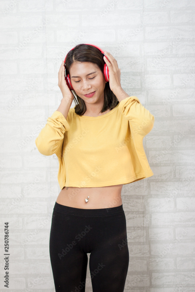 beautiful girl yellow coath happy and funny from listening music beautiful girl yellow coath happy and funny from listening music
