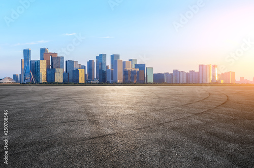 Empty asphalt square ground and Hangzhou business district cityscape