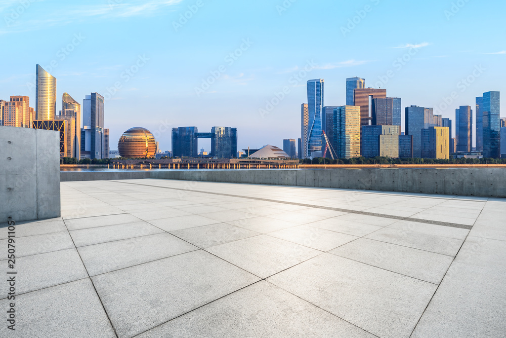 Empty square floor and Hangzhou city skyline with buildings Empty square floor and Hangzhou city skyline with buildings