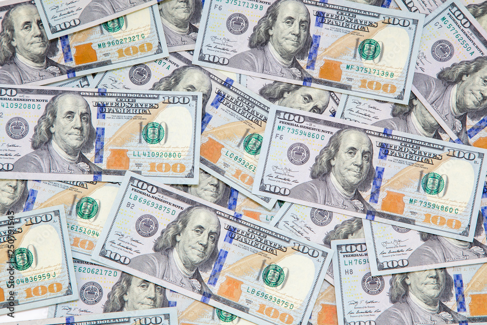 Background of dollar bills. American Dollars Cash Money. One Hundred Dollar Banknotes. Hundred Bucks. Benjamin Franklin's portrait