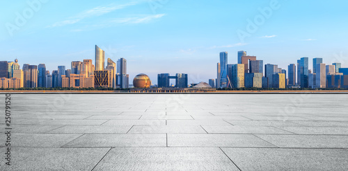 Empty square floor and Hangzhou city skyline with buildings