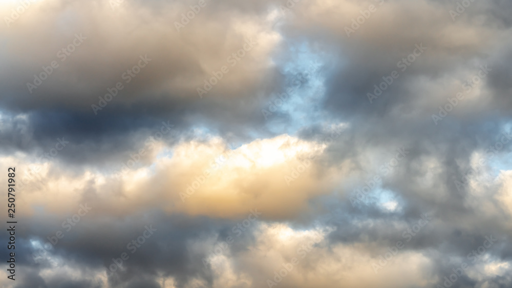 dramatic clouds against the blue sky