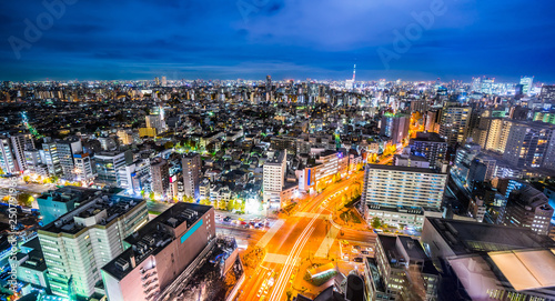 Asia Business concept for real estate & corporate construction - panoramic modern city skyline view of Shibuya & expressway with neon night in bunkyo district, Tokyo, Japan