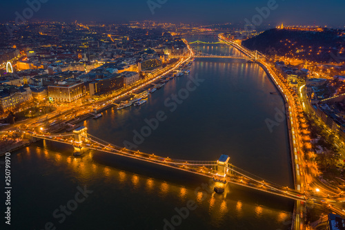 Budapest, Hungary - Aerial view at blue hour of Szechenyi Chain Bridge, Elisabeth Bridge and Statue of Liberty at winter time