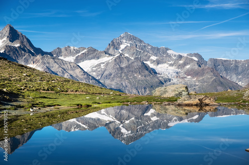 Fototapeta Naklejka Na Ścianę i Meble -  Mountain lake in Switzerland. High mountains region at the day time. Natural landscape in Swiss mountains. Switzerland landscape - image