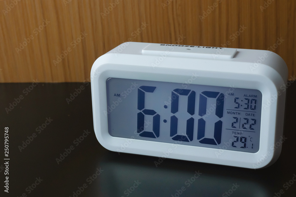 Digital alarm clock 6:00 close up image. Stock Photo | Adobe Stock