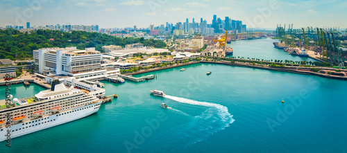 Panoramic harbor landscape of Singapore. Cruise ship in port.