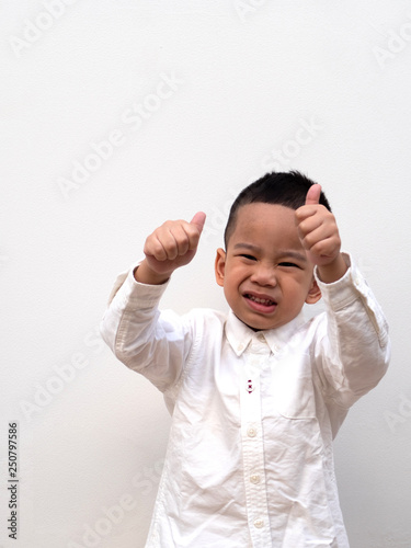 very happy asian boy making thumbs up sign