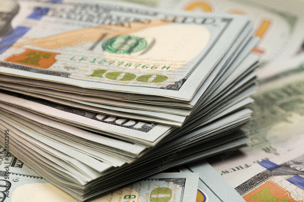 Stack of one hundred dollar bills close-up. Stack of one hundred dollar bills close-up.