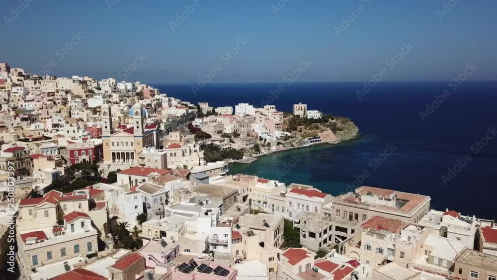 Aerial drone bird's eye view video of iconic and picturesque district of Vaporia with landmark church of Agios Nikolaos, city of Ermoupoli, Syros island, Capital of Cyclades ,Greece Aerial drone bird's eye view video of iconic and picturesque district of Vaporia with landmark church of Agios Nikolaos, city of Ermoupoli, Syros island, Capital of Cyclades ,Greece