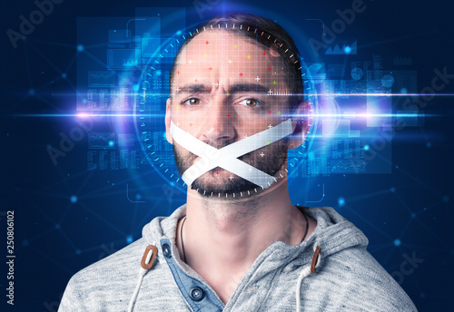 Facial recognition system. Young man on blue background