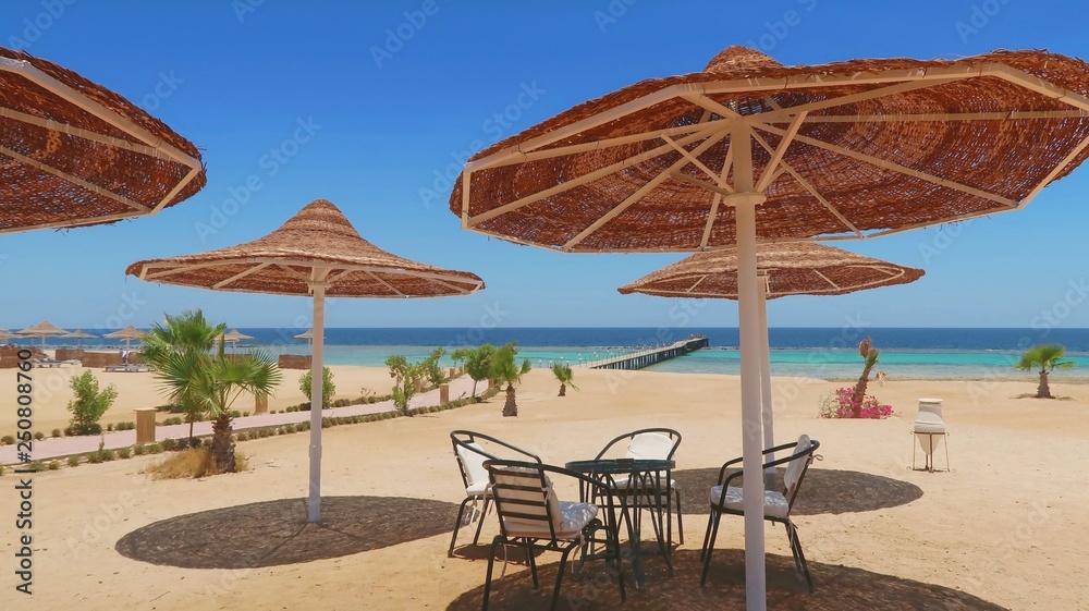 Idylic hotel beach with sun umbrelas, Red Sea, Egypt
