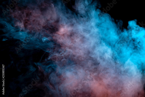 Background of orange, purple, red and blue wavy smoke on a black isolated ground. Abstract pattern of steam from vape of smoothly rising clubs. Mocap and print for t-shirt. © Aleksandr Kondratov
