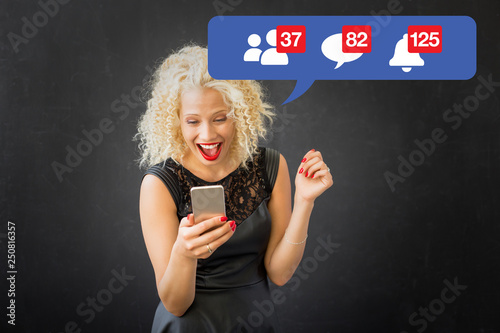 Woman excited about activity on social media photo