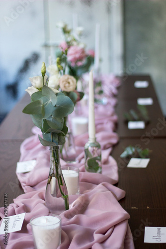 Wedding reception decoration with beautiful flowers and candles