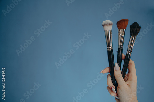 Make up brushes on blue background