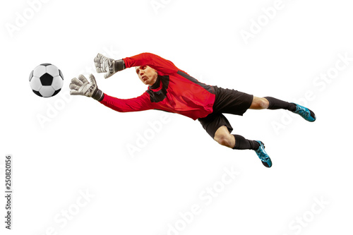 Foto Male soccer player goalkeeper catching ball in jump