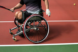 People with disabilities in a wheelchair playing tennis at the Paralympics