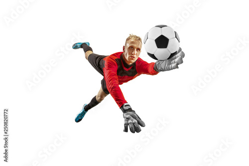 Fototapete Male soccer player goalkeeper catching ball in jump