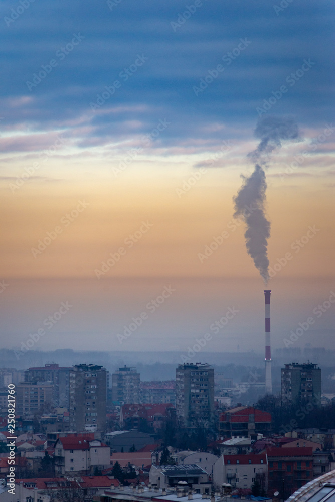Cityscape and view to the city central heating plant in the winter season