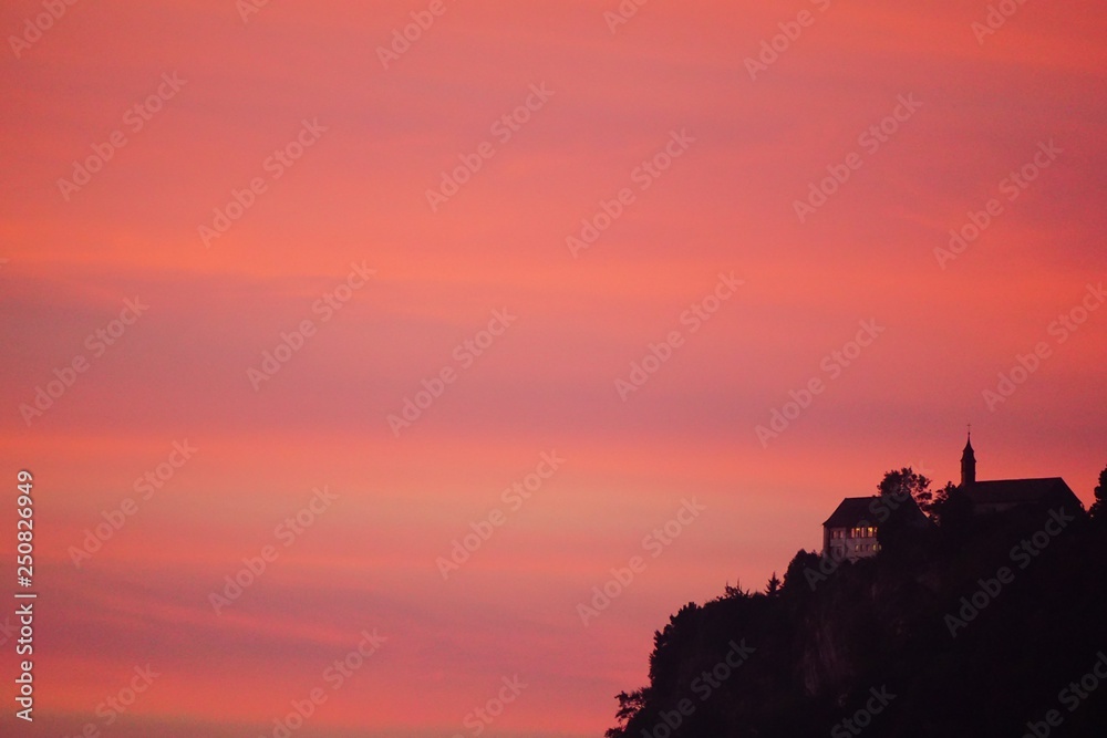 Red sunset with castle on mountain Red sunset with castle on mountain