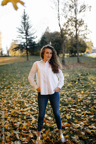 Portrait of a beautiful  female model in autmn clothes outdoor sensetive look photo