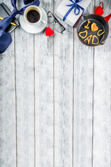 Father's day holiday concept, greeting card background with presents and pancakes letter inscription For best father, I love you dad, wooden background copy space top view