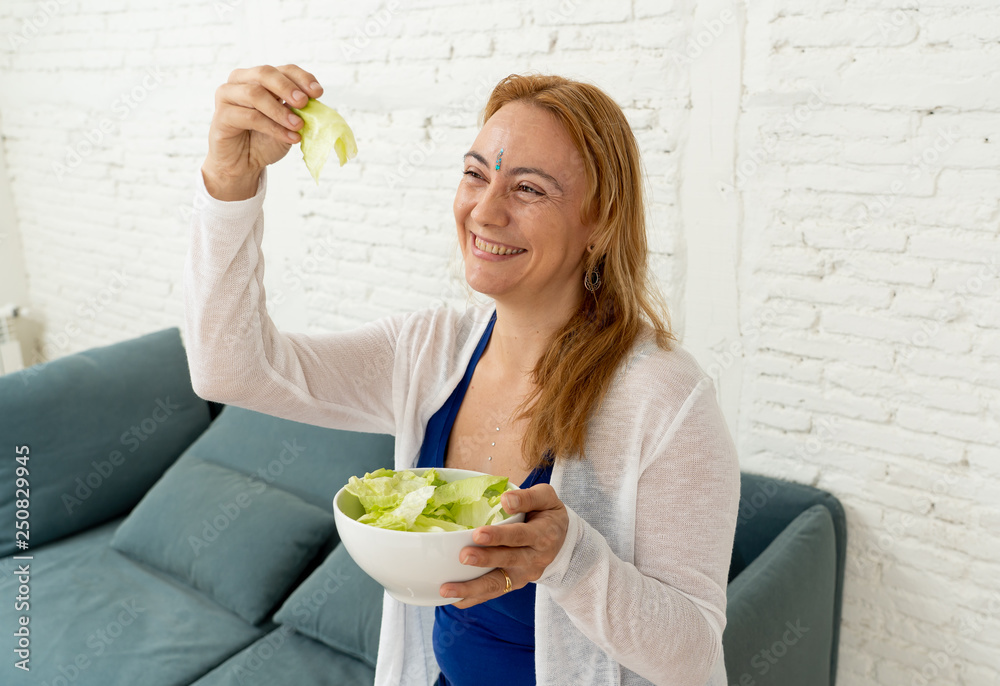 Happy beautiful woman smiling holding healthy fresh vegetable salad in healthy lifestyle concept Happy beautiful woman smiling holding healthy fresh vegetable salad in healthy lifestyle concept