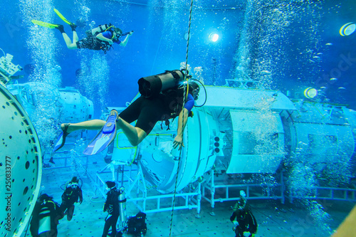 MOSCOW REGION, RUSSIA - FEBRUARY 14, 2014: The International Space Station plunged into the test pool of the Cosmonaut Training Center, divers training, editorial