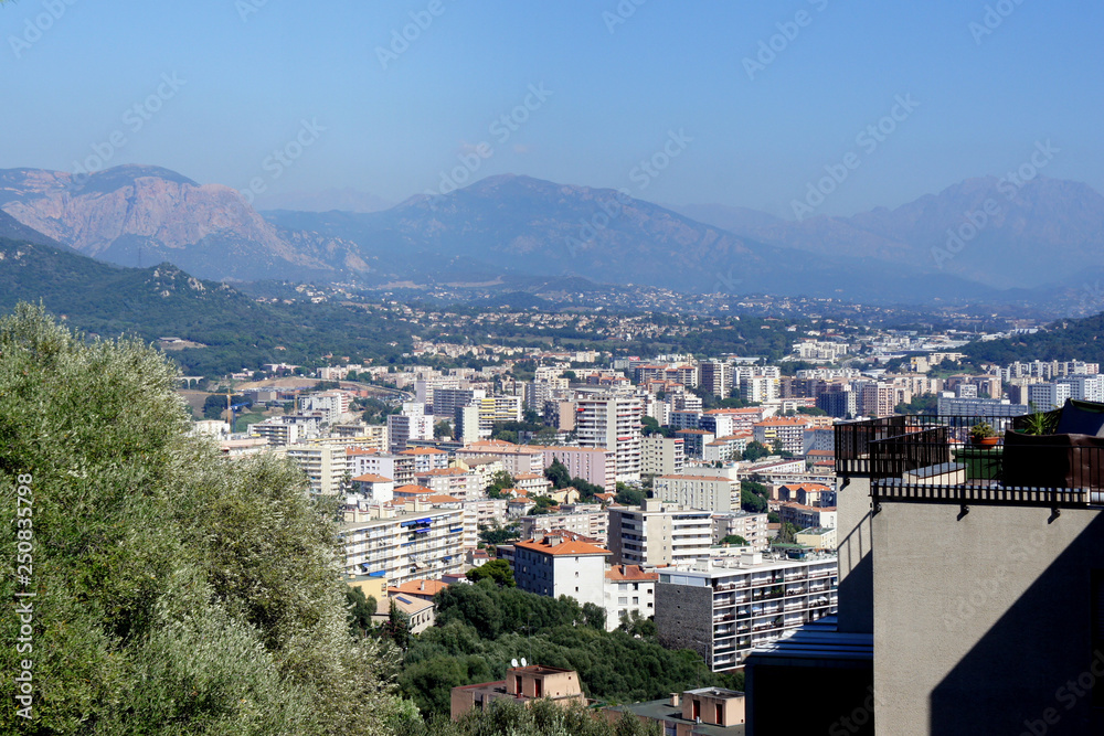 Corsica.Modern areas of the city of Ajaccio with the mountains surrounding them. 