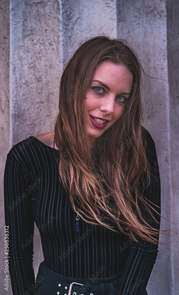 fashionable portrait of young beautiful woman in a European city on a sunny winter day fashionable portrait of young beautiful woman in a European city on a sunny winter day