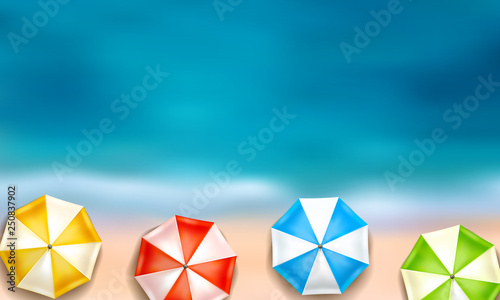 beautiful summer background with sea, beach and colourful parasols from above