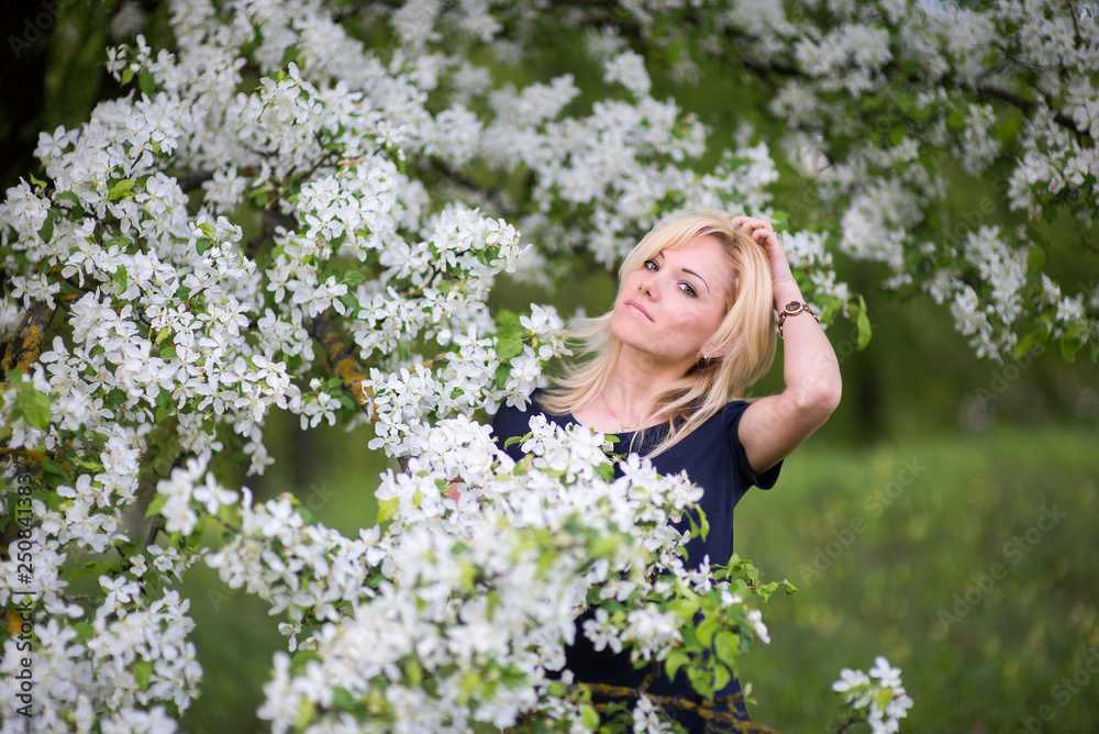 Beautiful girl on the background of spring bush Beautiful girl on the background of spring bush