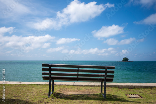 Wooden bench in front of the sea