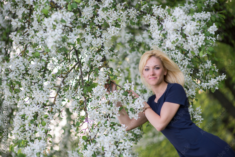 Beautiful girl on the background of spring bush Beautiful girl on the background of spring bush