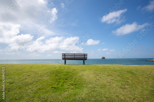 Fototapeta Naklejka Na Ścianę i Meble -  Wooden bench in front of the sea