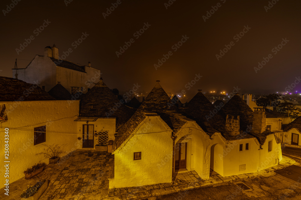 ALBEROBELLO, APULIA, ITALY - FEBRUARY 03 - Beautiful view of the traditional trulli houses with their conical roof on february 03, 2019 