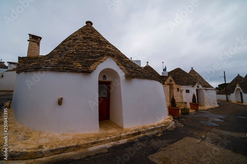 ALBEROBELLO, APULIA, ITALY - FEBRUARY 03 - Beautiful view of the traditional trulli houses with their conical roof on february 03, 2019  © czamfir