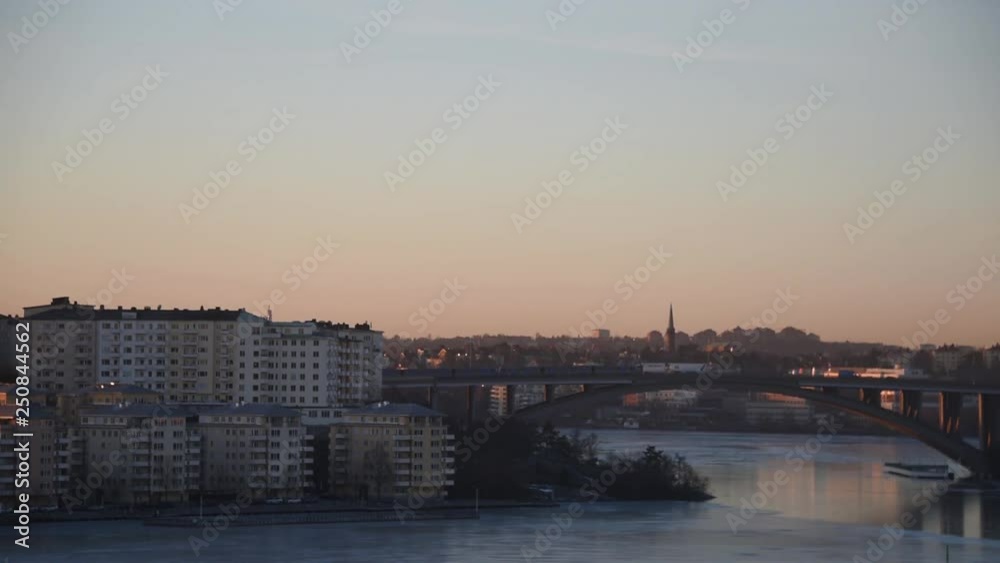 Morning view over a bridge in Stockholm and a passing tram Morning view over a bridge in Stockholm and a passing tram