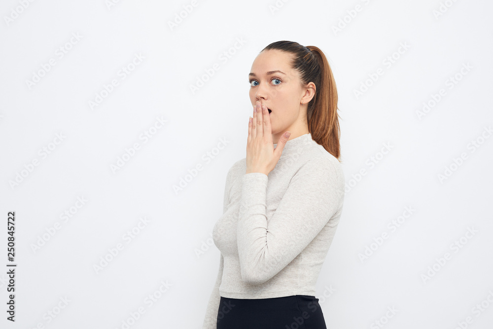portrait of young girl hiding something making don't tell portrait of young girl hiding something making don't tell