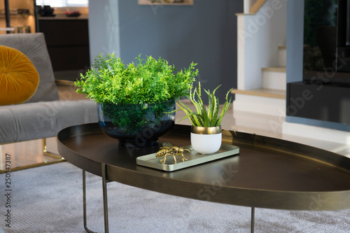 colorful and stylish living room with flower vase on table. photo