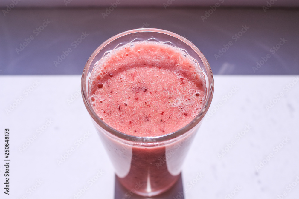 Smoothies in the glass on the white background Smoothies in the glass on the white background