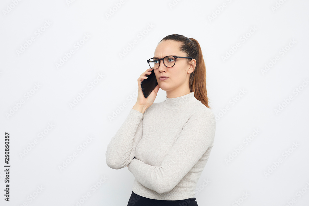 serious business woman talking on the phone serious business woman talking on the phone