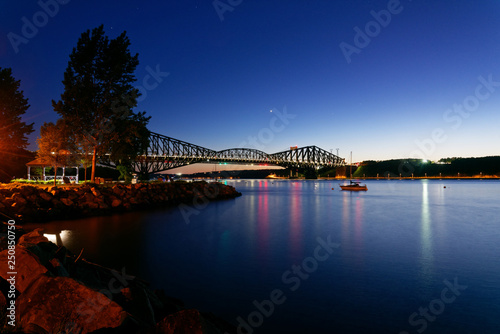 The Pont du Quebec and the St Lawrence River at dusk as seen from Parc de la Marina-de-la-Chaudière, St-Romuald